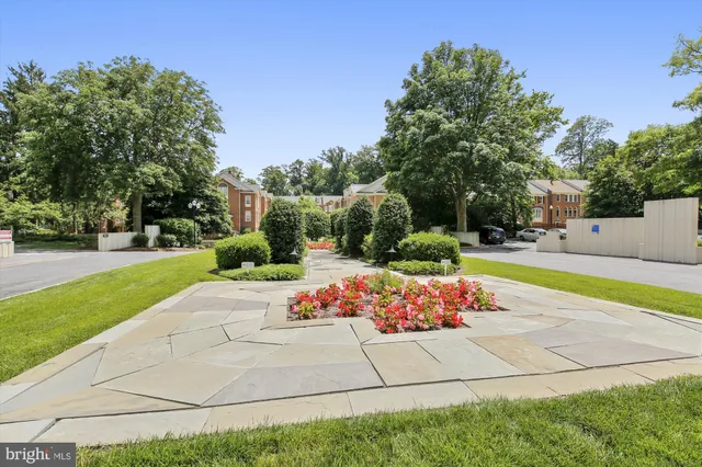 a living room with furniture a flat screen tv and a large window