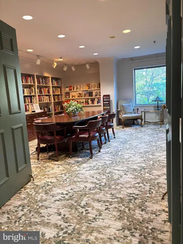 a swimming pool with outdoor seating and yard