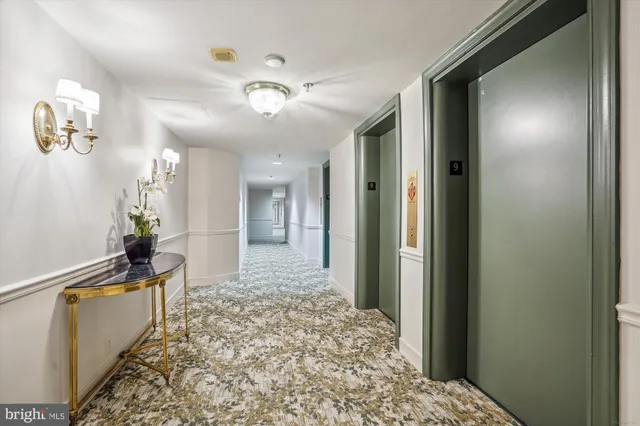 a very nice looking hallway with a chandelier