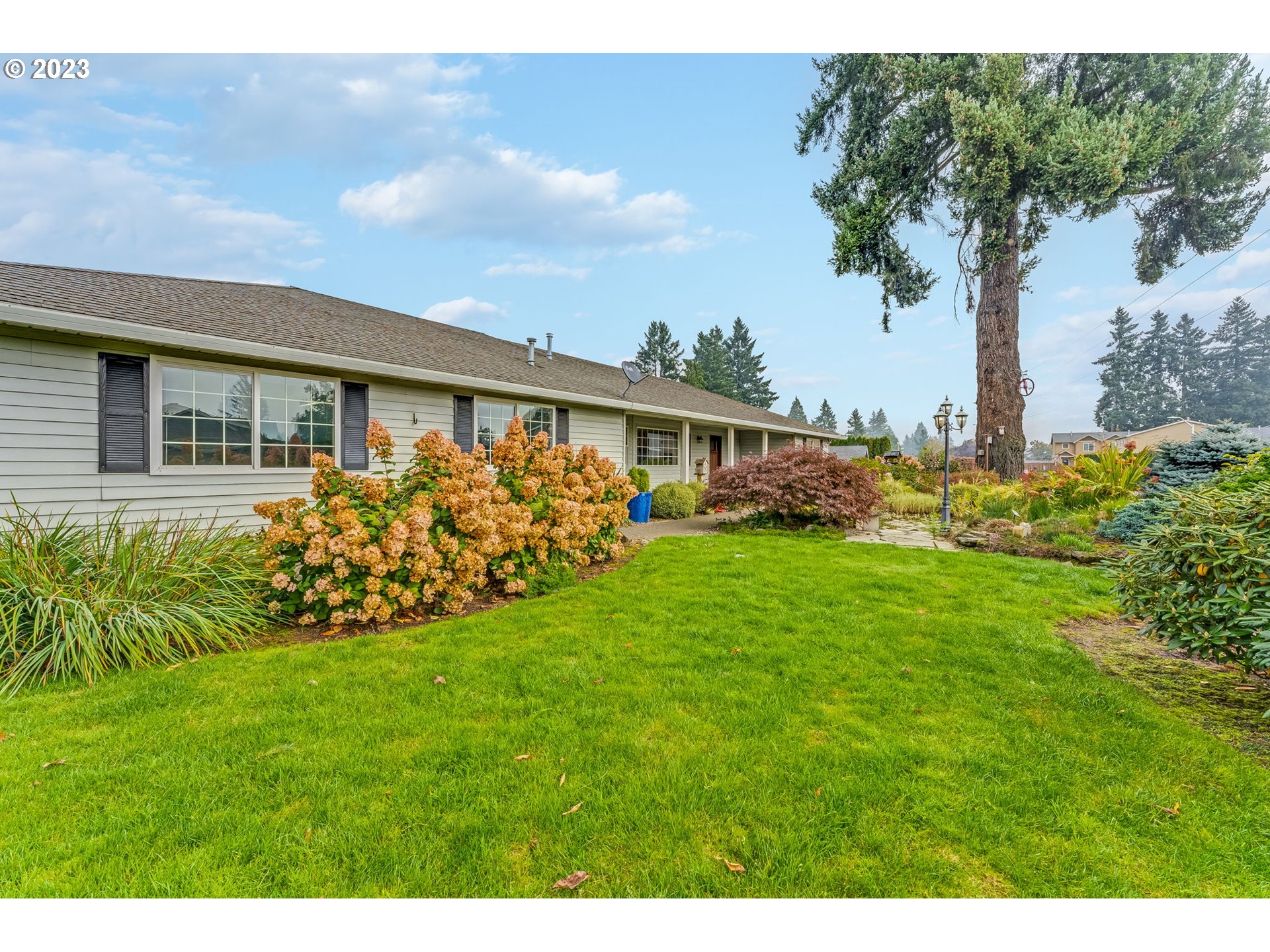 1740 North Laurelwood Loop Canby, OR 97013 - Photo 2 of 46 a view of house with garden