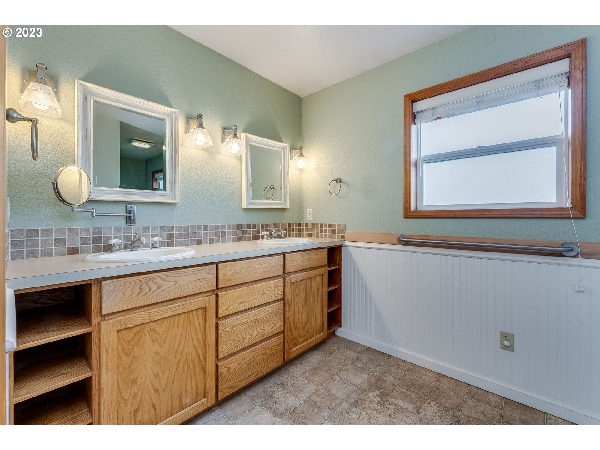 1740 North Laurelwood Loop Canby, OR 97013 - Photo 31 of 46 a bathroom with a sink vanity and mirror