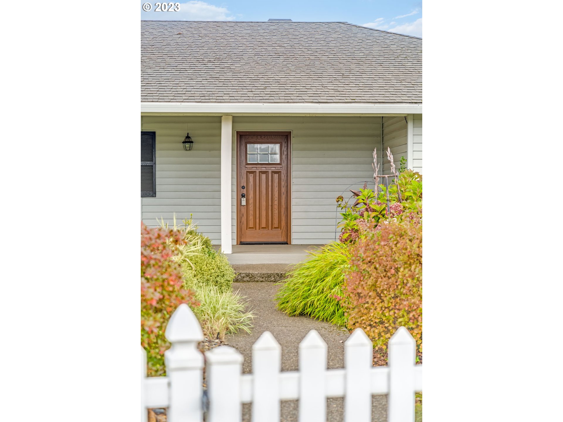 1740 North Laurelwood Loop Canby, OR 97013 - Photo 34 of 46 a front view of a house with a yard