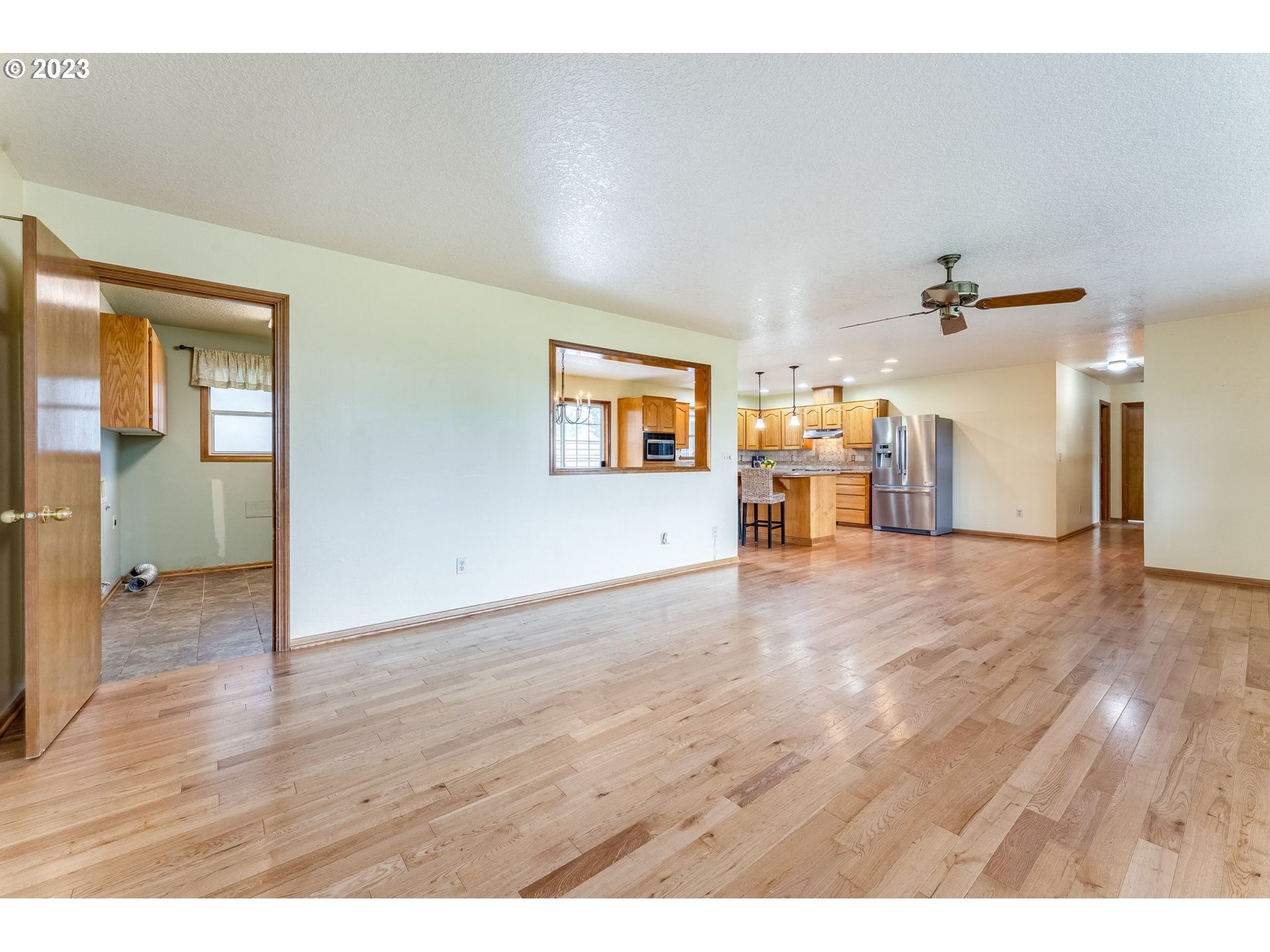 1740 North Laurelwood Loop Canby, OR 97013 - Photo 10 of 46 a view of a livingroom with furniture and wooden floor