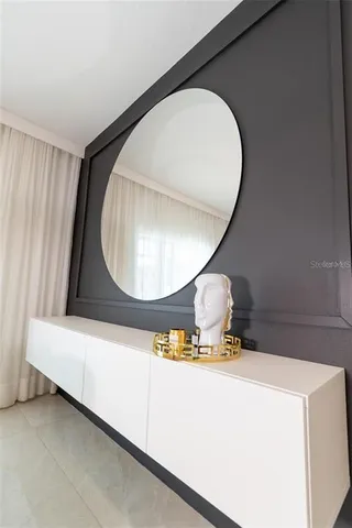 a bathroom with a mirror and a light
