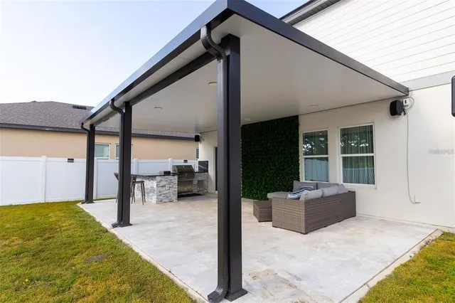 a view of a patio with furniture