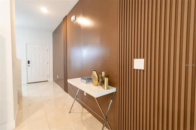 a bathroom with a sink mirror and a toilet
