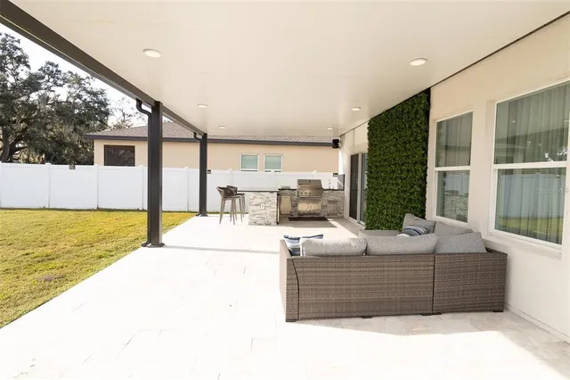 a bed room with furniture and a floor to ceiling window