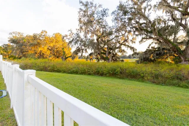 a view of a golf course with a lake