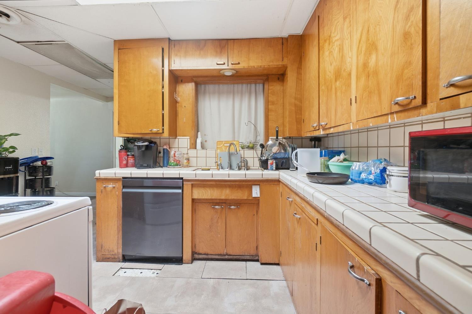 1705 Stetson Avenue Modesto, CA 95350 - Photo 15 of 32 a kitchen with a sink and cabinets