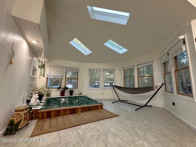 a living room with furniture and a table