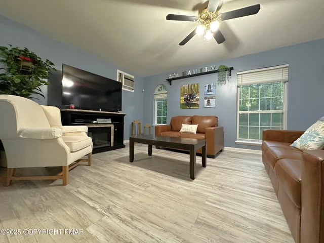 a living room with furniture and a flat screen tv