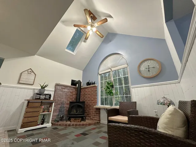 a living room with furniture and a clock