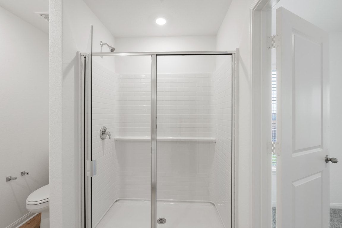 112 Paria Court Jarrell, TX 76537 - Photo 7 of 7 a bathroom with a glass shower door