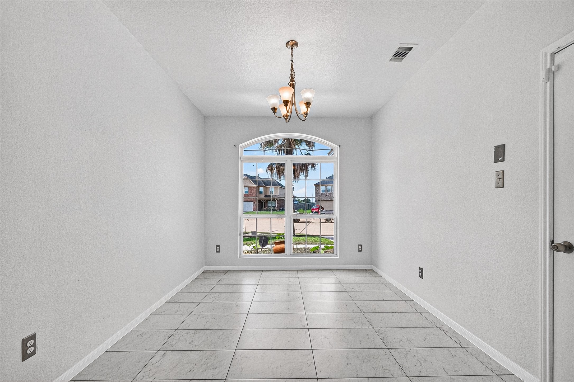 2702 Modano Court Fresno, TX 77545 - Photo 11 of 46 a view of an empty room with a window