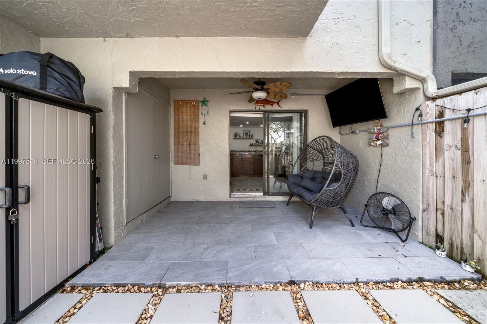 10415 Southwest 154th Court, Unit 2 Miami, FL 33196 - Photo 12 of 27 a view of a livingroom with storage space
