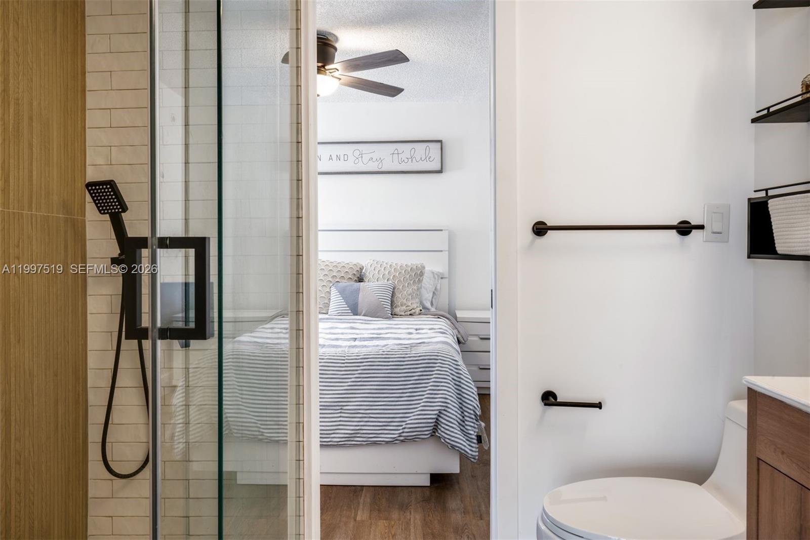 10415 Southwest 154th Court, Unit 2 Miami, FL 33196 - Photo 17 of 27 a bathroom with a shower toilet and sink