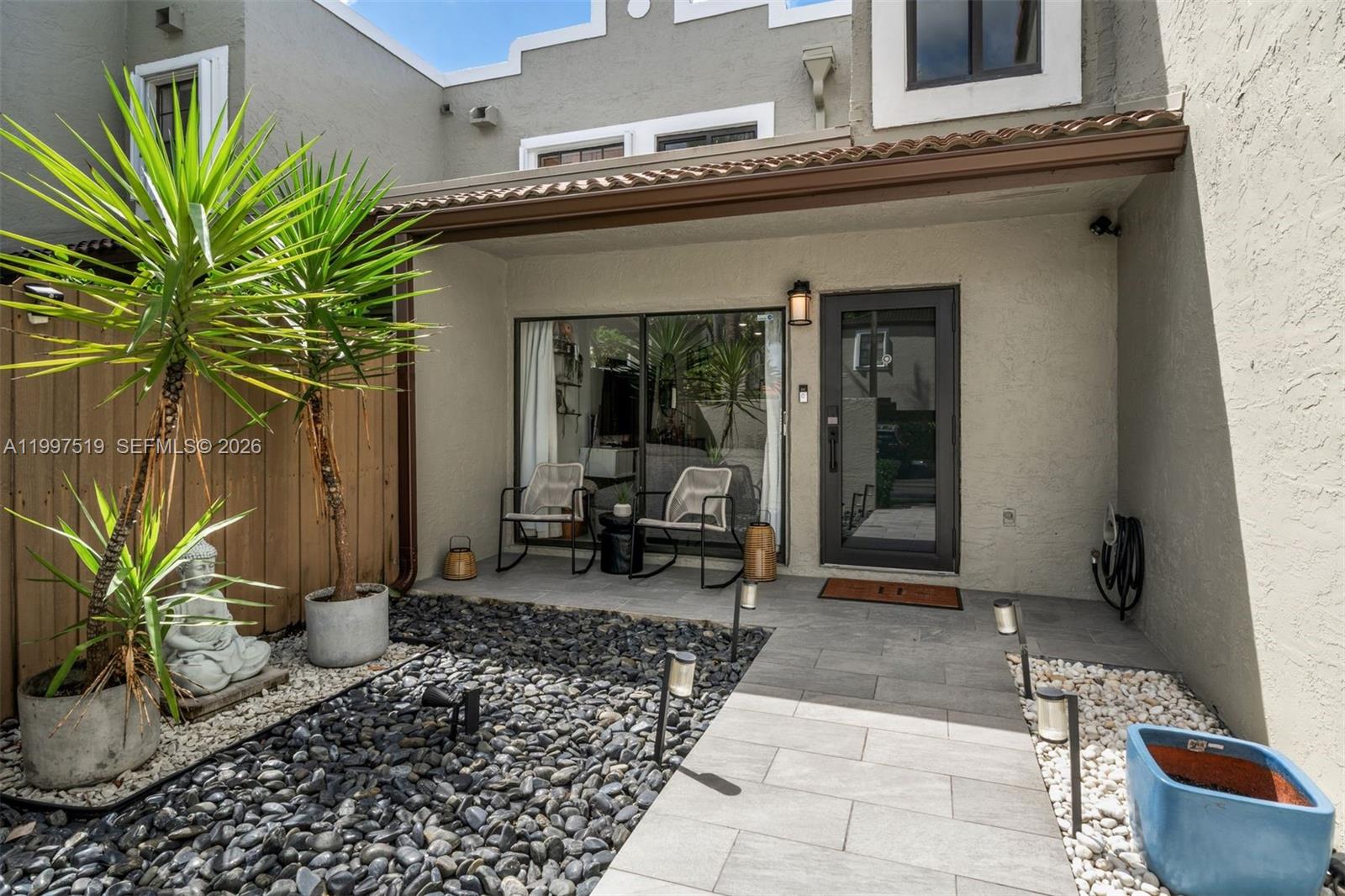 10415 Southwest 154th Court, Unit 2 Miami, FL 33196 - Photo 2 of 27 a view of a entryway door front of house