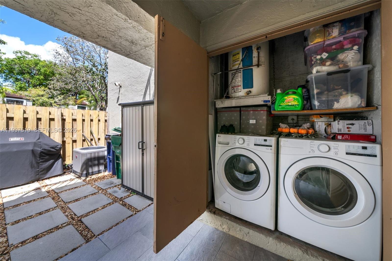 10415 Southwest 154th Court, Unit 2 Miami, FL 33196 - Photo 25 of 27 a utility room with dryer and washer