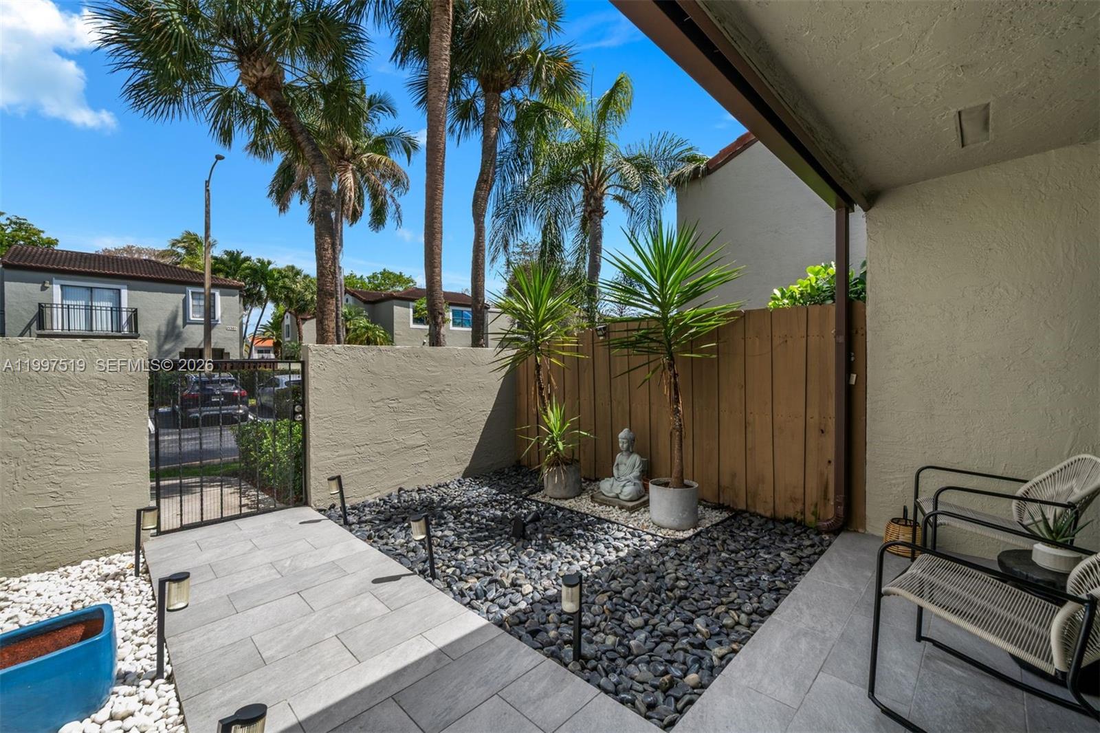 10415 Southwest 154th Court, Unit 2 Miami, FL 33196 - Photo 3 of 27 a view of a backyard with a patio