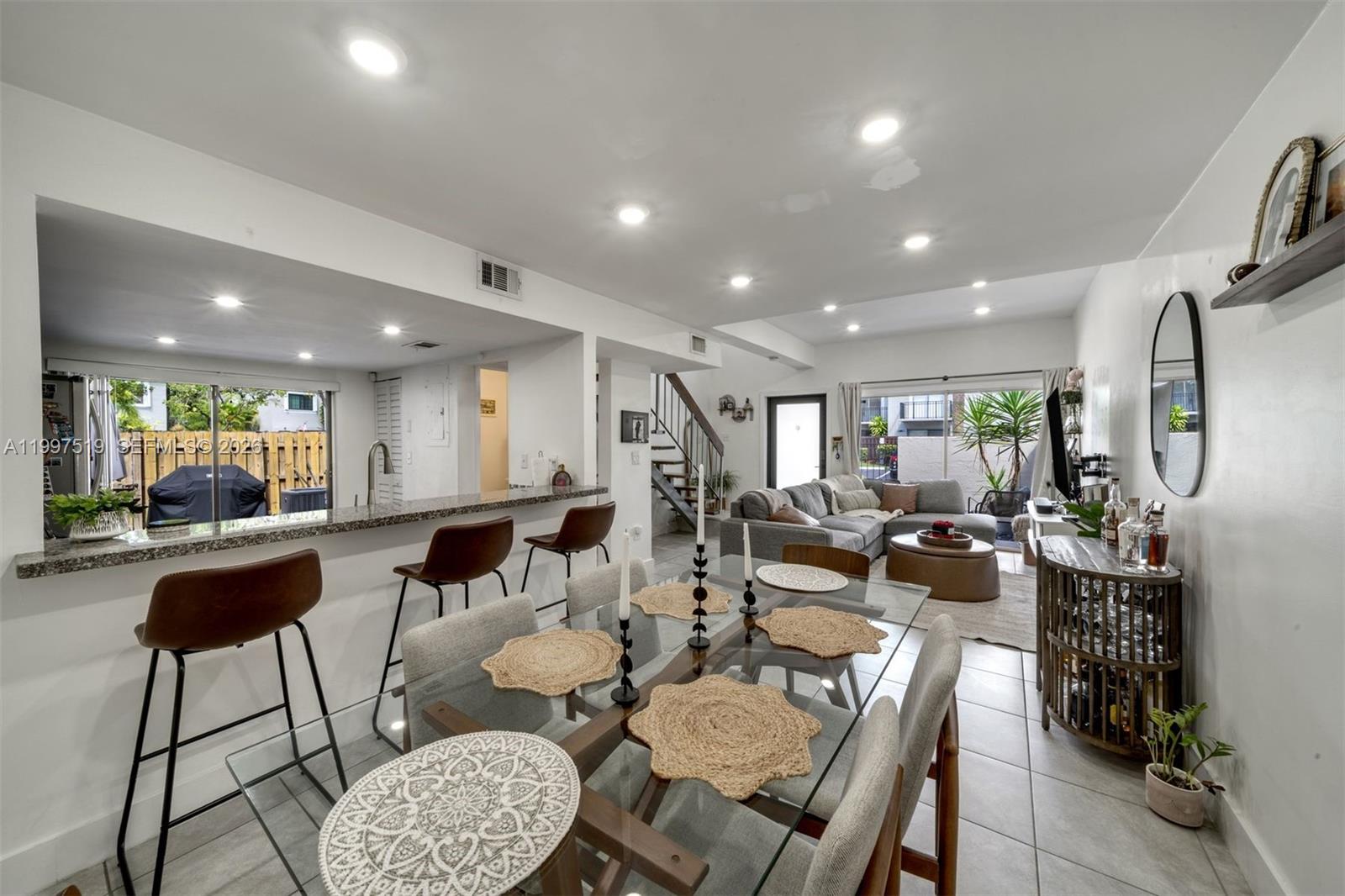10415 Southwest 154th Court, Unit 2 Miami, FL 33196 - Photo 8 of 27 a view of a dining room with furniture