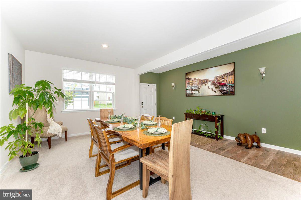 2052 Pomona Way Frederick, MD 21702 - Photo 12 of 71 a dining room with furniture and a potted plant