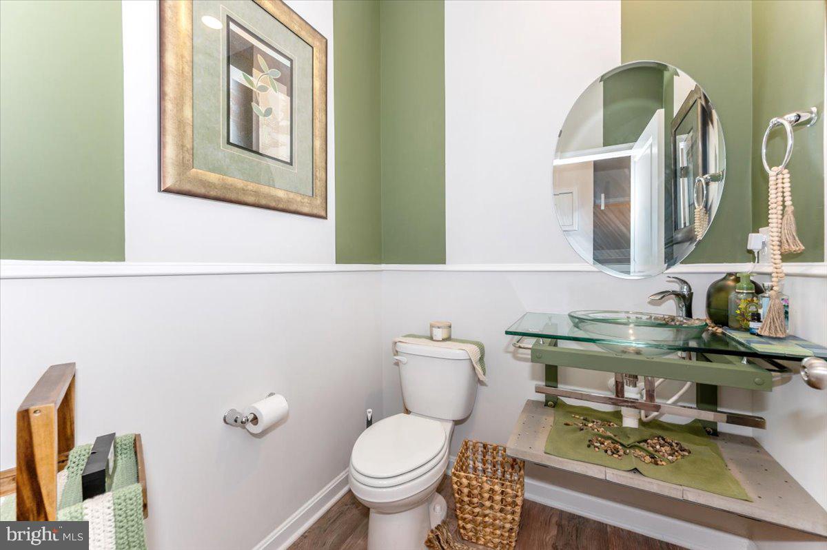 2052 Pomona Way Frederick, MD 21702 - Photo 22 of 71 a bathroom with a toilet a sink and mirror