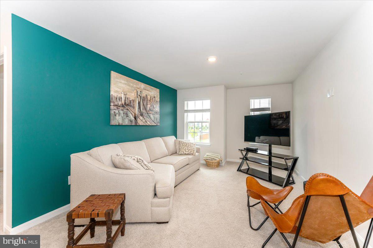 2052 Pomona Way Frederick, MD 21702 - Photo 24 of 71 a living room with furniture and a flat screen tv
