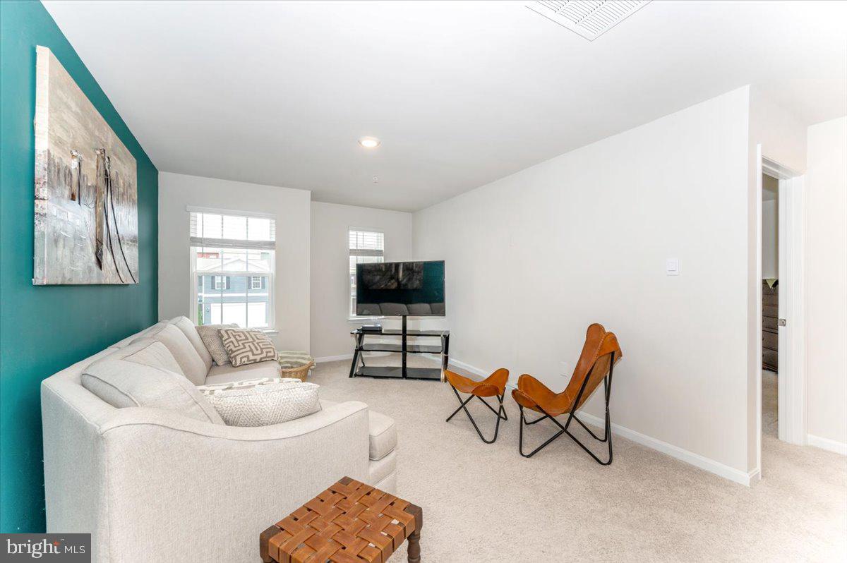 2052 Pomona Way Frederick, MD 21702 - Photo 25 of 71 a living room with furniture and a flat screen tv
