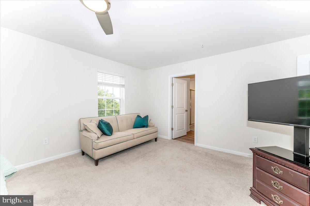 2052 Pomona Way Frederick, MD 21702 - Photo 29 of 71 a living room with furniture and a flat screen tv