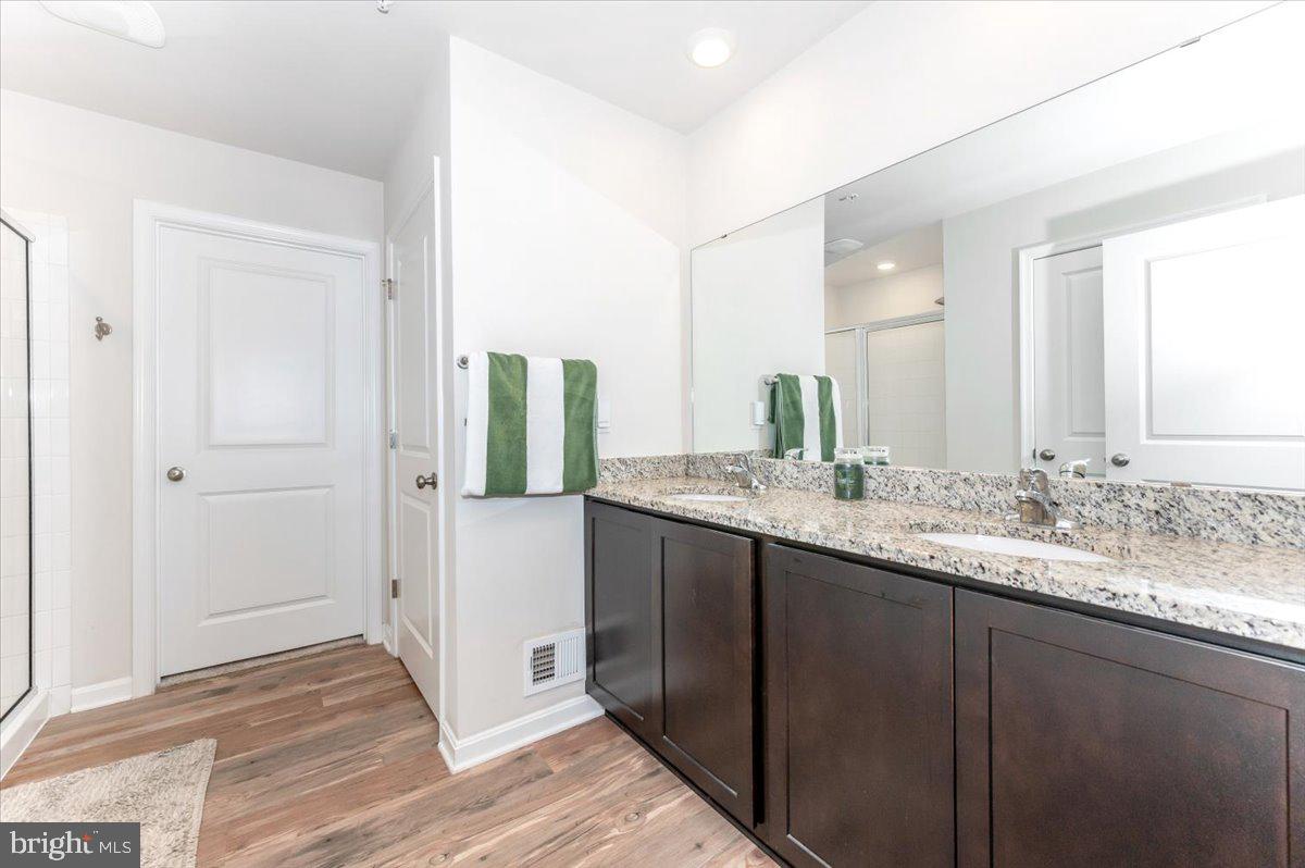 2052 Pomona Way Frederick, MD 21702 - Photo 30 of 71 a bathroom with a granite countertop sink and a mirror