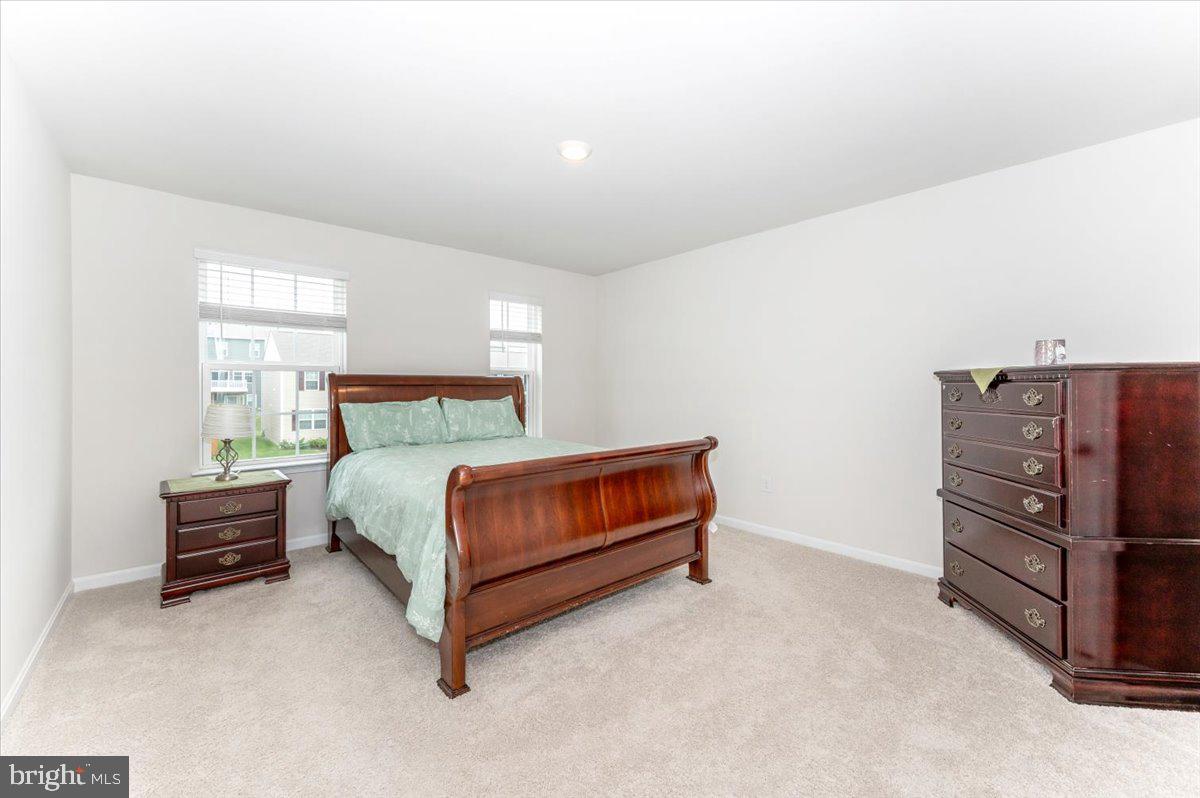 2052 Pomona Way Frederick, MD 21702 - Photo 33 of 71 a bedroom with a bed and dresser