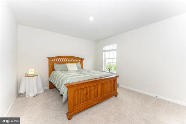 a kitchen with stainless steel appliances granite countertop a refrigerator and a stove