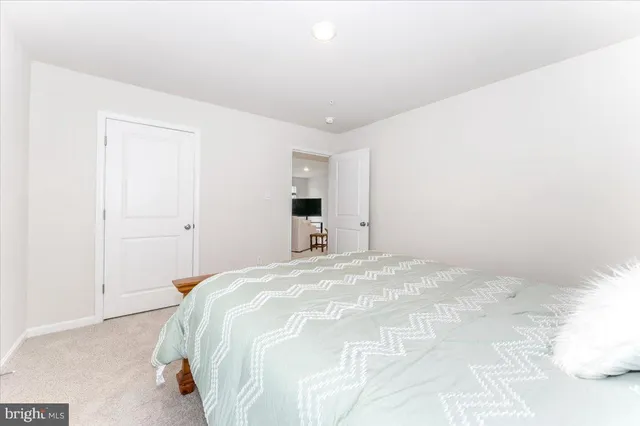 a kitchen with stainless steel appliances granite countertop a refrigerator and a stove