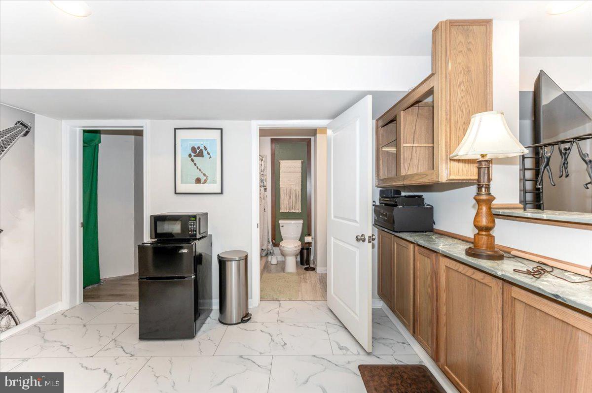 2052 Pomona Way Frederick, MD 21702 - Photo 44 of 71 a kitchen with stainless steel appliances granite countertop a refrigerator and a stove