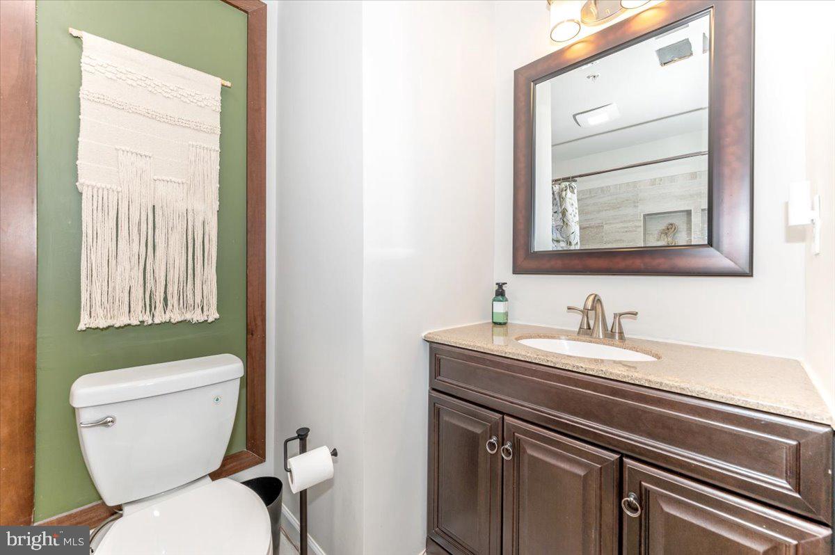 2052 Pomona Way Frederick, MD 21702 - Photo 45 of 71 a bathroom with a toilet sink and mirror