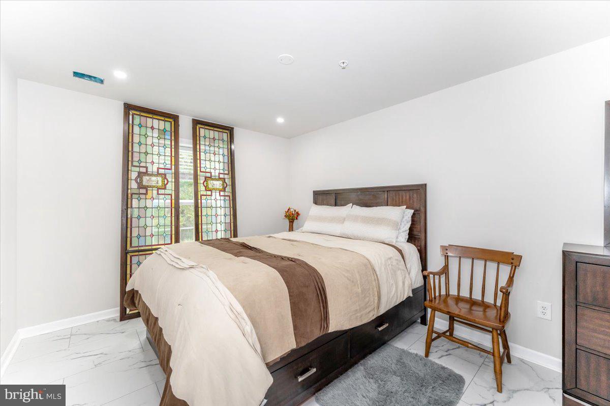 2052 Pomona Way Frederick, MD 21702 - Photo 47 of 71 a large bed sitting in a bedroom next to a window