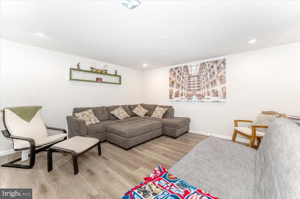 2052 Pomona Way Frederick, MD 21702 - Photo 49 of 71 a living room with furniture and a wooden floor
