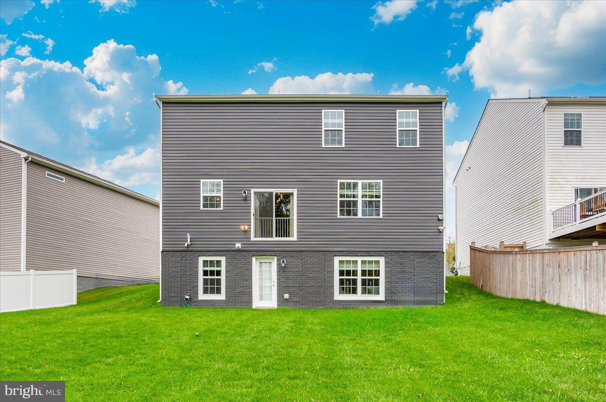 2052 Pomona Way Frederick, MD 21702 - Photo 57 of 71 a brick house with a yard