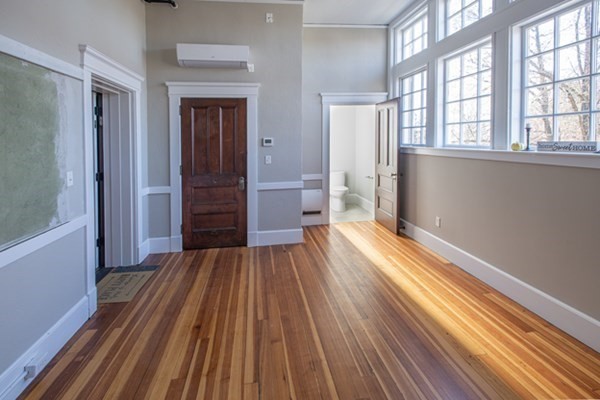 58 Main Street, Unit 4 Hatfield, MA 01038 - Photo 12 of 42 wooden floor in an empty room with a window