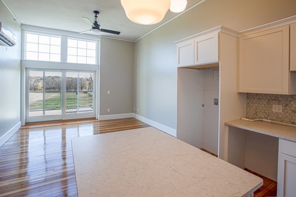 58 Main Street, Unit 4 Hatfield, MA 01038 - Photo 23 of 42 a view of empty room with wooden floor and fan