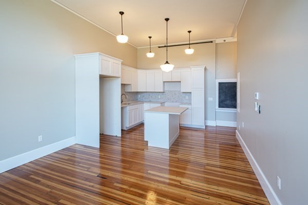 58 Main Street, Unit 4 Hatfield, MA 01038 - Photo 26 of 42 a view of a kitchen with wooden floor and a kitchen
