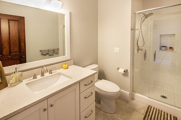58 Main Street, Unit 4 Hatfield, MA 01038 - Photo 27 of 42 a bathroom with a sink a toilet and shower