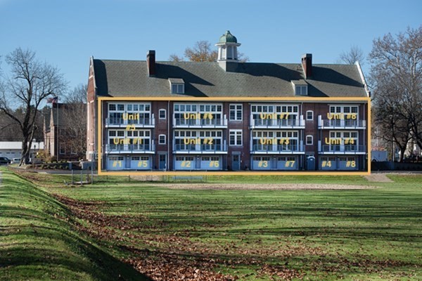 58 Main Street, Unit 4 Hatfield, MA 01038 - Photo 4 of 42 a view of a big building with a big yard and potted plants
