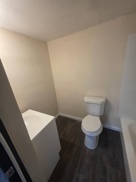 446 Lexington Livingston, TX 77351 - Photo 13 of 14 a white toilet sitting next to a white wall