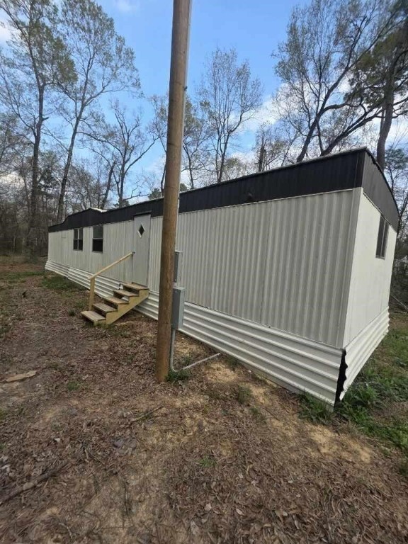 446 Lexington Livingston, TX 77351 - Photo 2 of 14 a view of a backyard with a large tree