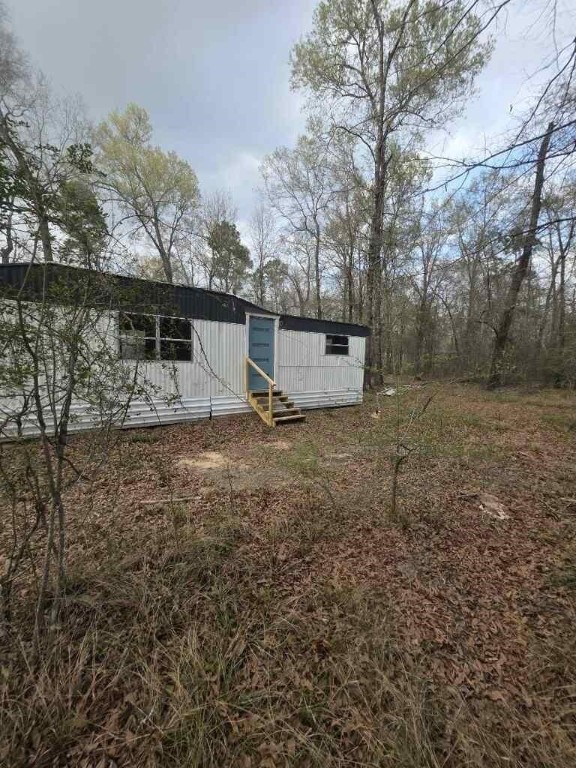 446 Lexington Livingston, TX 77351 - Photo 4 of 14 a view of a backyard with large tree