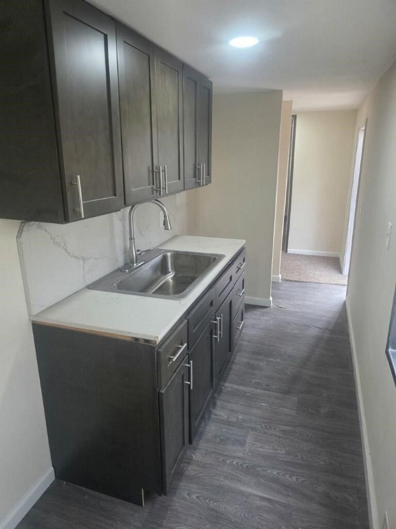 446 Lexington Livingston, TX 77351 - Photo 5 of 14 a kitchen with a sink and cabinets
