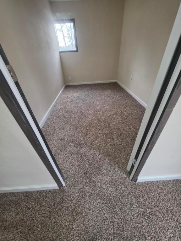 446 Lexington Livingston, TX 77351 - Photo 8 of 14 an empty room with a staircase