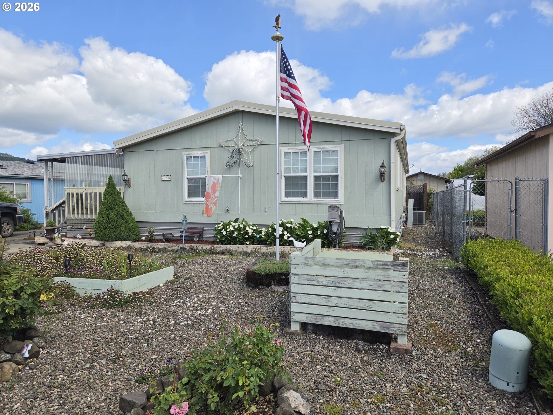 428 South State Street Sutherlin, OR 97479 - Photo 2 of 10 a front view of a house with garden