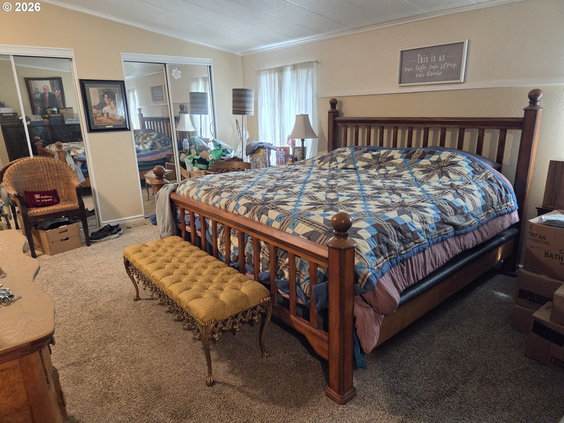 428 South State Street Sutherlin, OR 97479 - Photo 6 of 10 a bed sitting in a bedroom next to a window